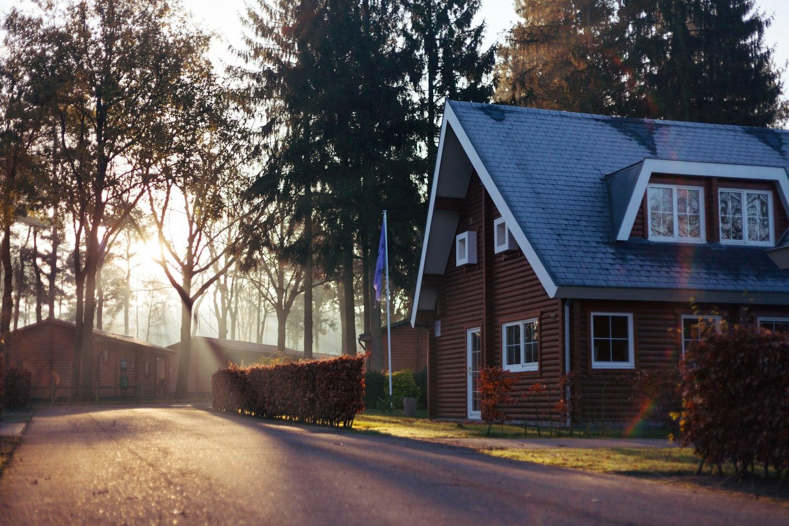 Sample: wood-sided home with a shingle roof in morning light